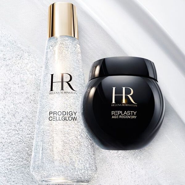Helena Rubinstein Prodigy Cellglow Serumflasche (klar, Blaschen) und Re-Plasty Cremetiegel (schwarz). Auf einem texturierten, leuchtenden weißen Hintergrund platziert, symbolisiert Eleganz und Pflegeeffizienz.